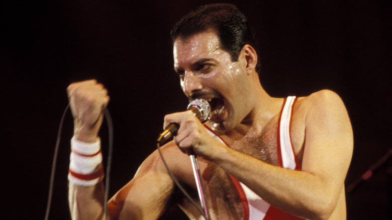 Freddie Mercury performing on stage