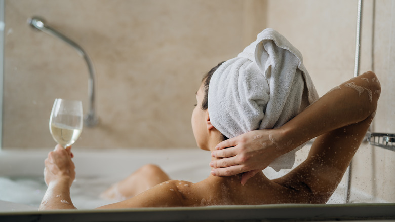 Woman relaxing in bathtub