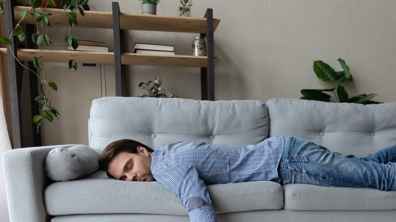 person sleeping on couch