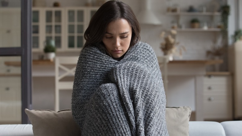 Woman wrapped in blanket