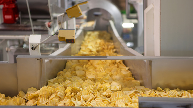 chips falling off a conveyor belt