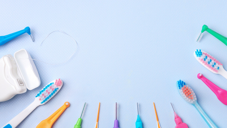 a colorful array of toothbrushes and floss