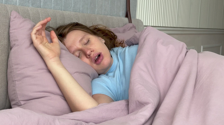 A woman sleeping with her mouth open