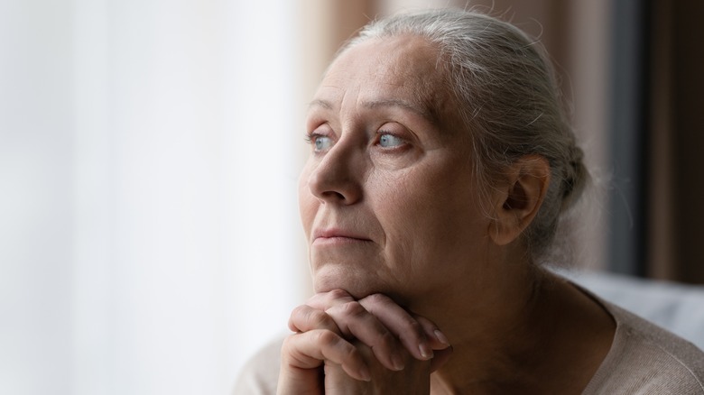 Elderly pensive woman