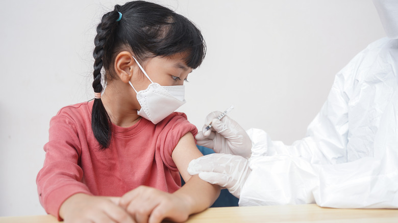 young girl getting vaccinated