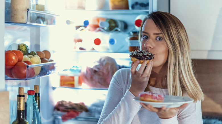 Woman eating donut 