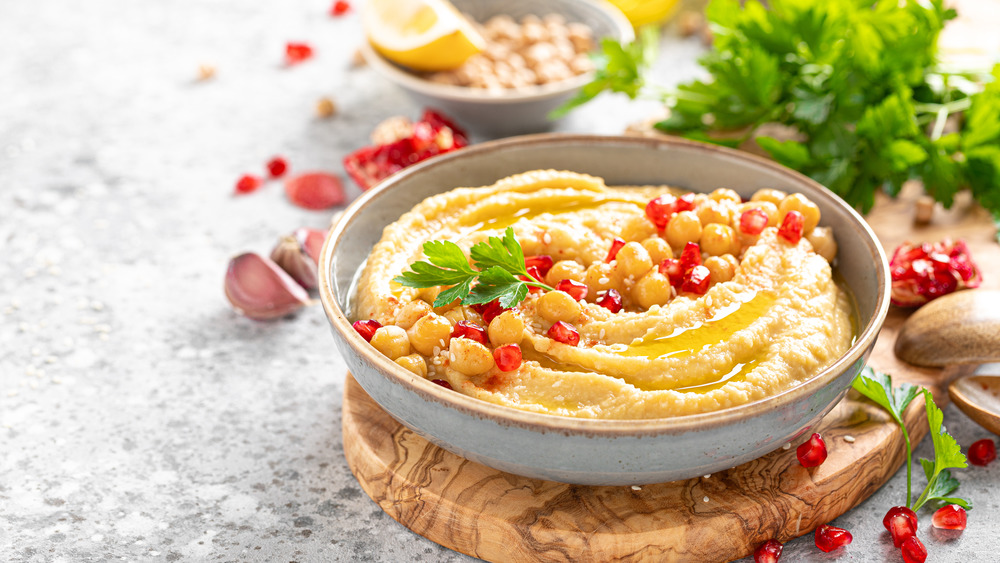 Hummus surrounded by vegetables