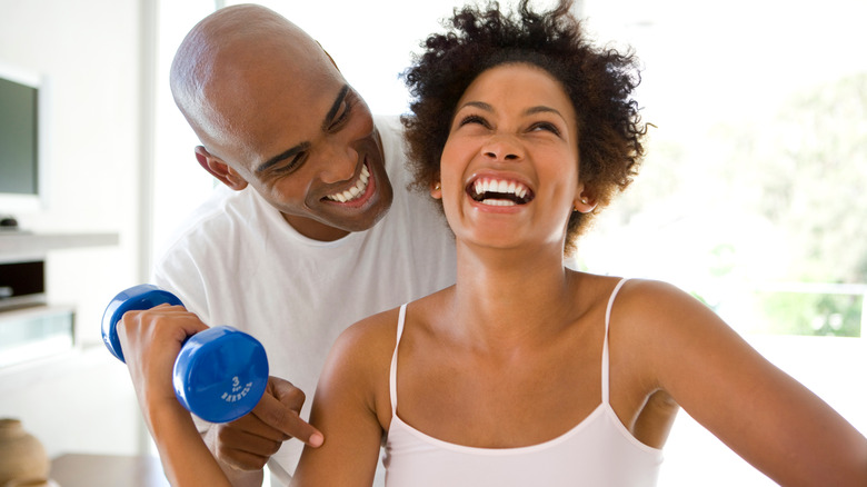 woman and man working out