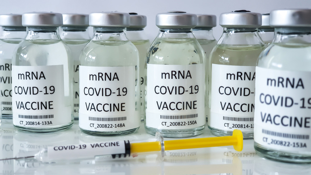 vial of mRNA vaccines with needle