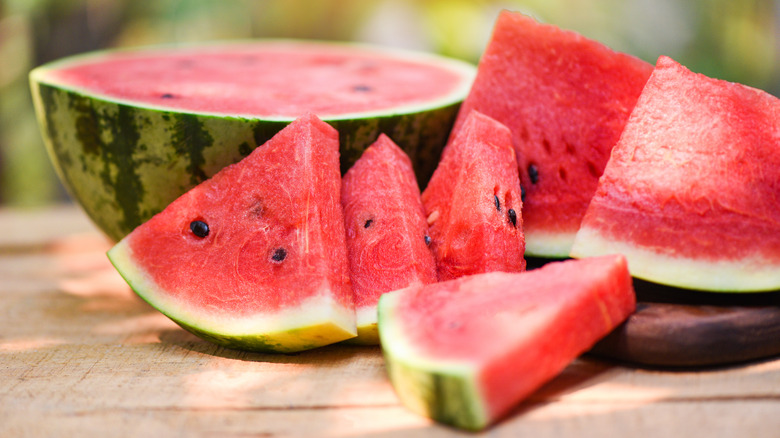 Slices of watermelon on a wooden table