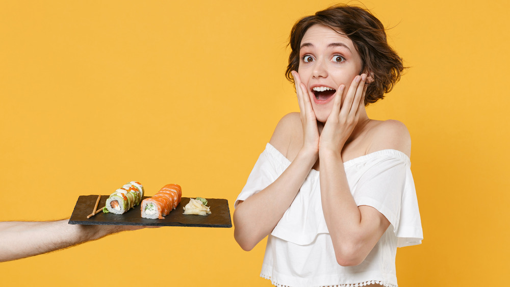 woman and sushi