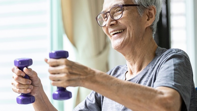 Senior woman lifting weights