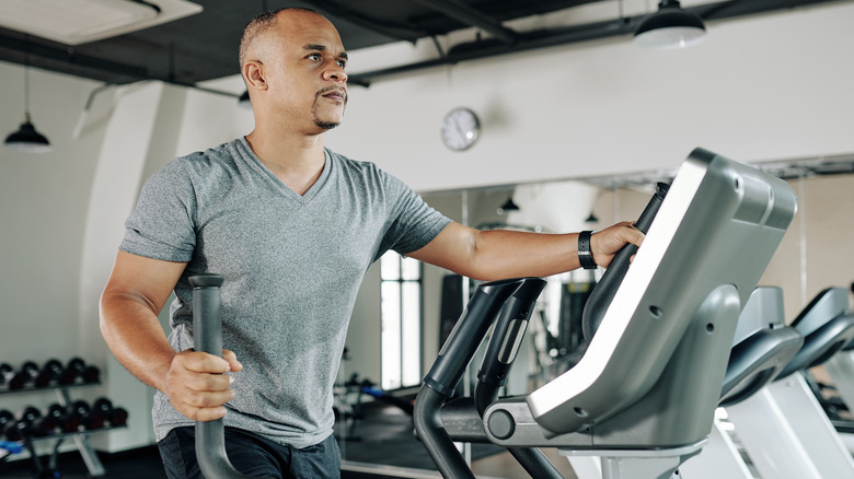 A man on an elliptical machine