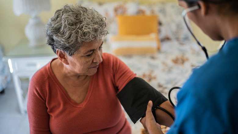 Woman getting her blood pressure taken 