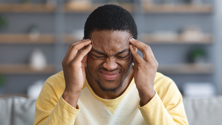 A man experiences a headache