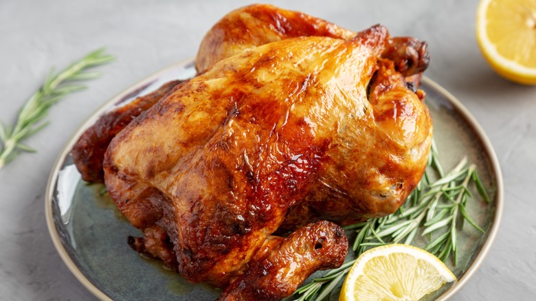 Family enjoying roast chicken dinner