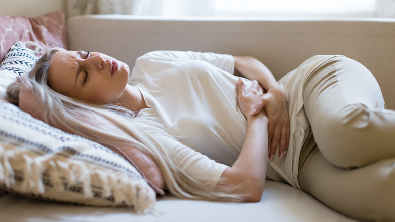 woman feeling nauseous 