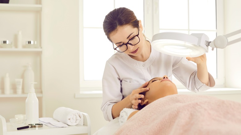 dermatologist checking patient