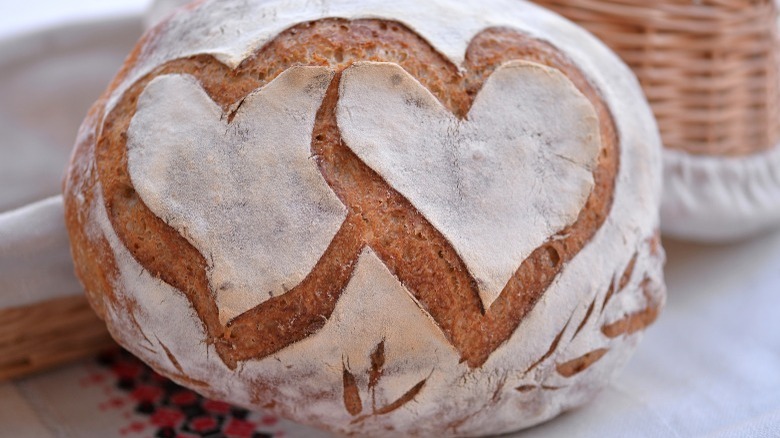 Sourdough loaf scored with two hearts 