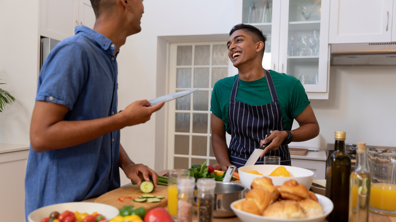 a couple cooking together 