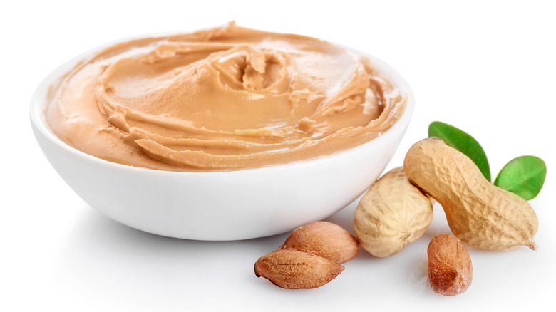 bowl of peanut butter and whole peanuts