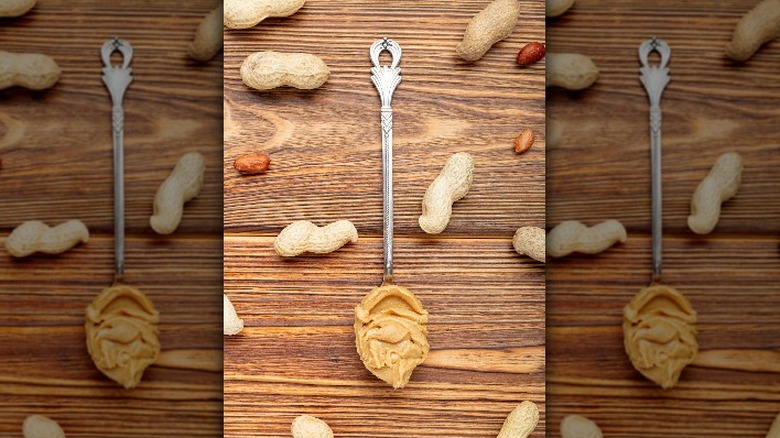 mirror images of peanut butter on a spoon