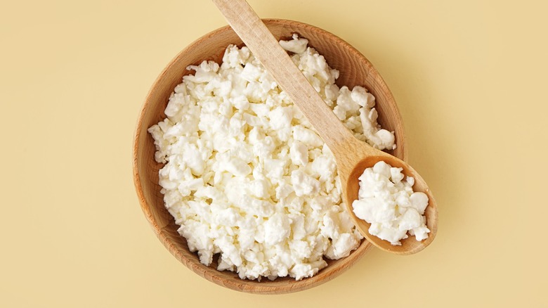 Cottage cheese in wooden bowl