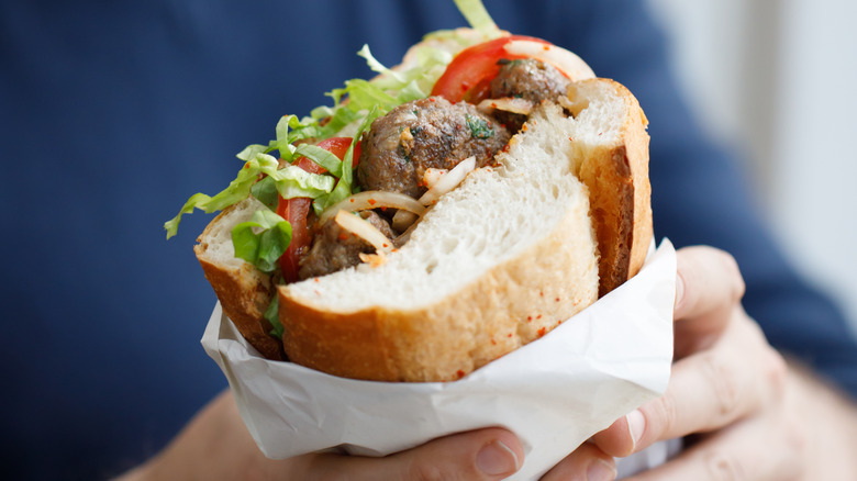 Man holding a sandwich