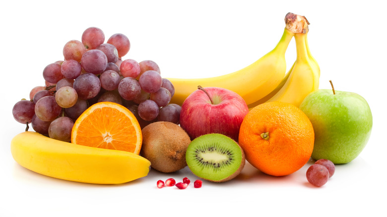 variety of fresh fruit on white background