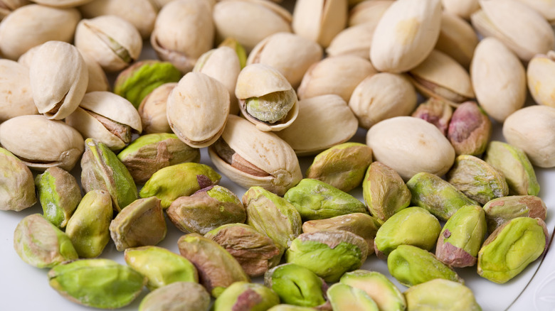 shelled and unshelled green pistachios