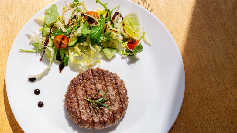 Beef patty on plate