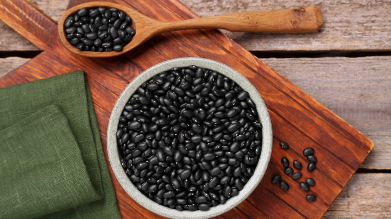 Spoon and bowl full of black beans