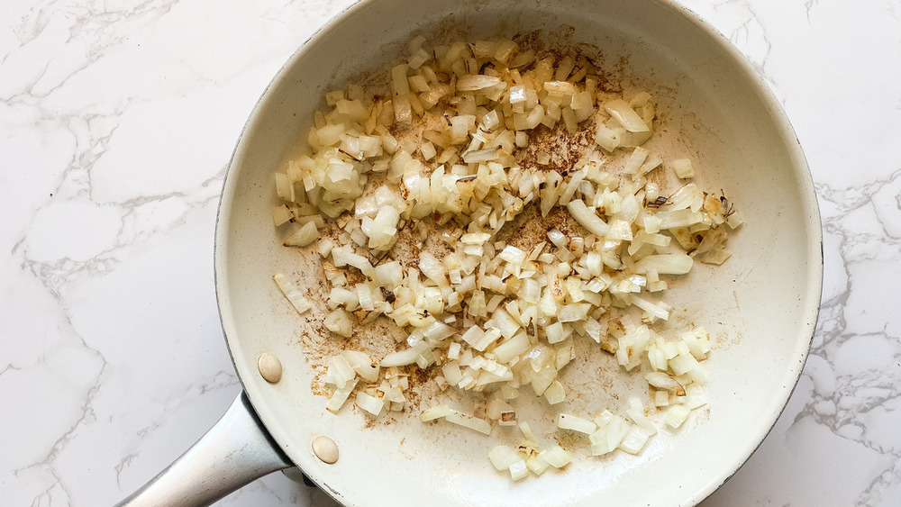 onions sautéing for healthy egg casserole