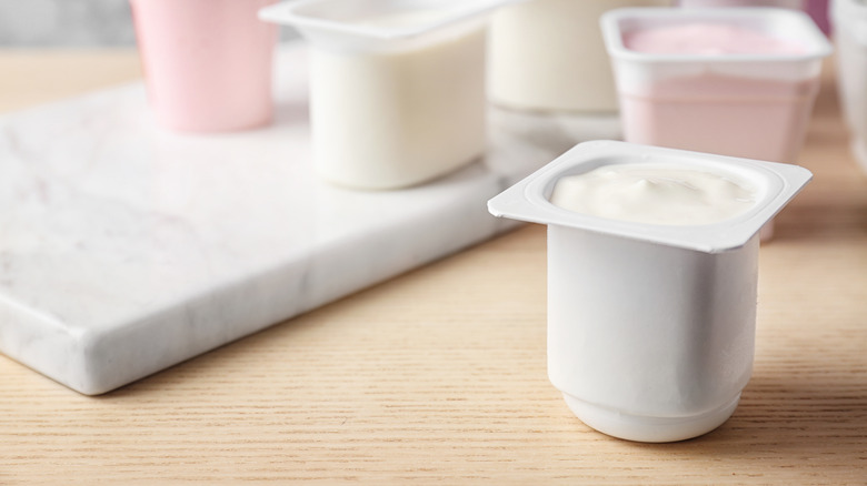 Several small containers of Greek yogurt
