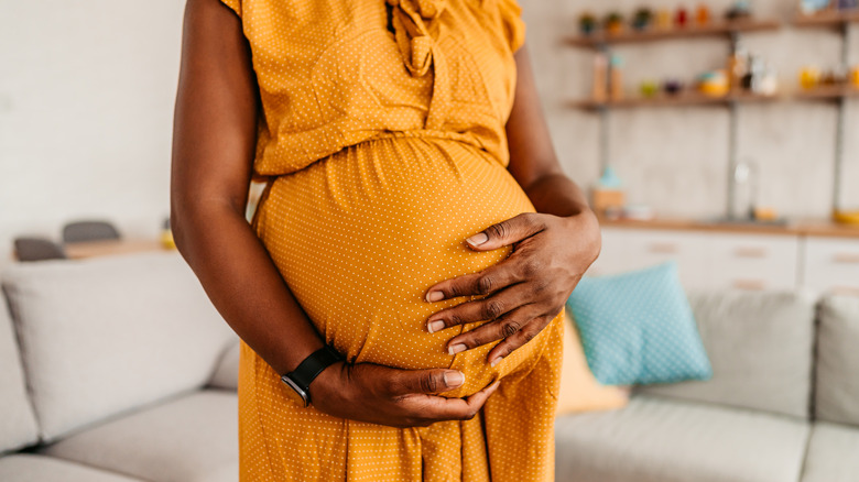 pregnant belly being held close up