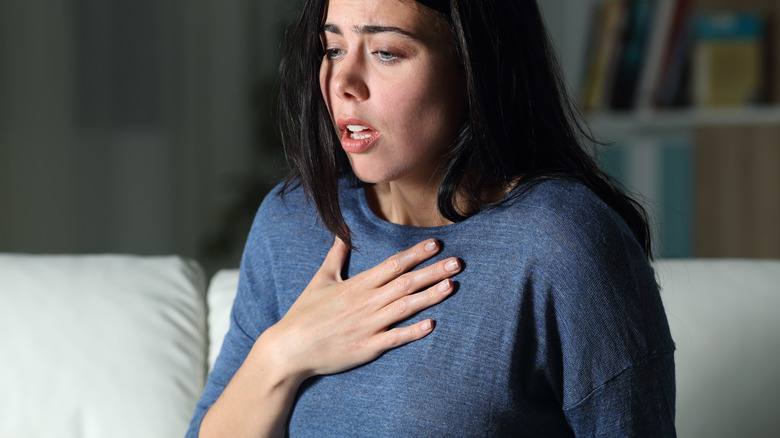 woman having allergy attack