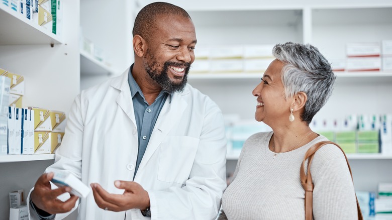 pharmacist talking to female customer