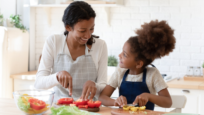 Woman and child cooking food