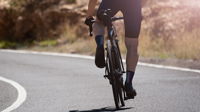 cyclist riding away