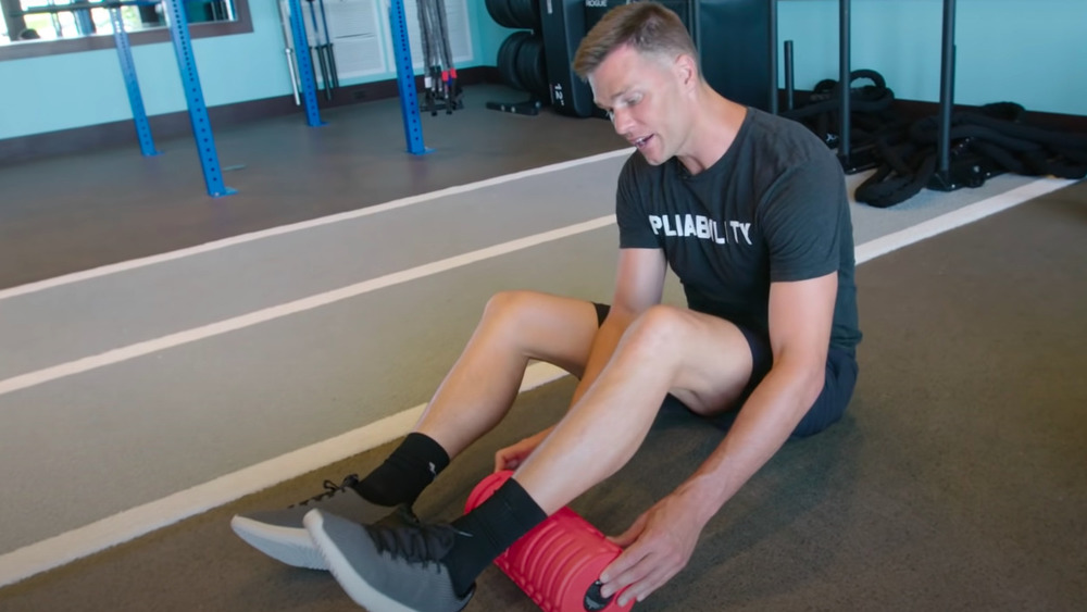 Tom Brady using foam roller