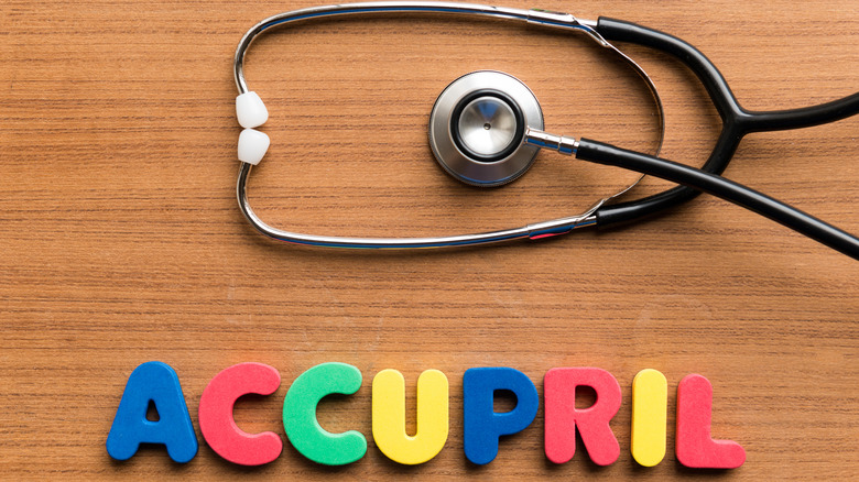 stethoscope and accupril letters on desk