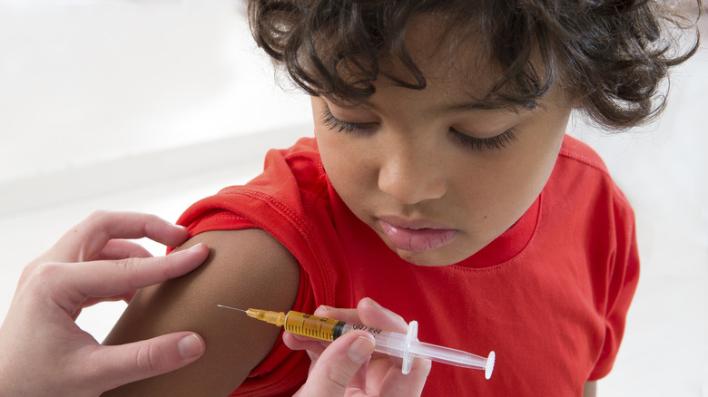 Young child receiving vaccine