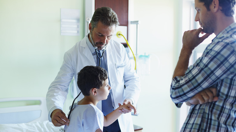 Doctor checking out a child
