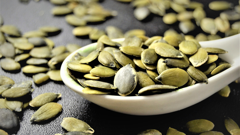 pumpkin seeds in a small bowl