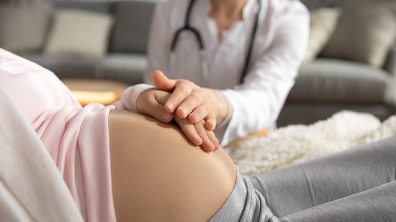 pregnant woman and nurse