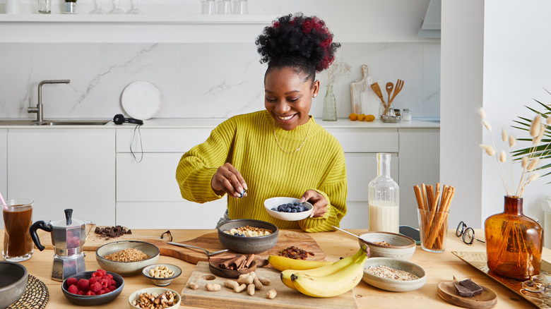 A young woman fixing healthy oatmeal