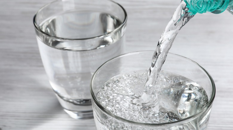 Pouring two glasses of water