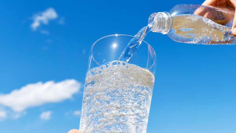 pouring a glass of sparkling water