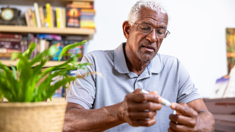 Man checking his blood sugar