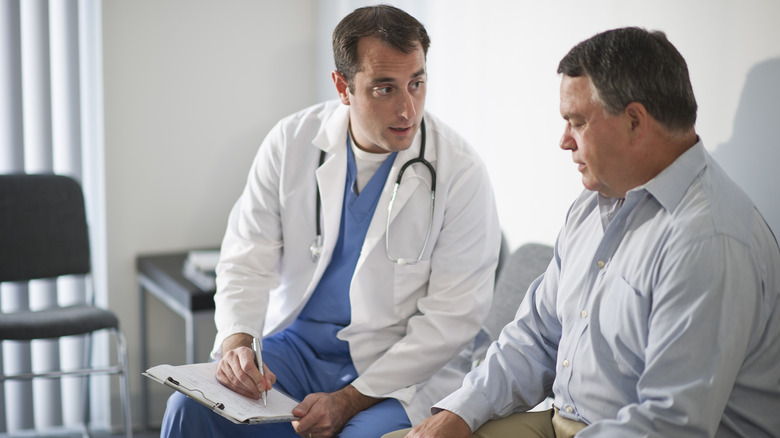 Doctor showing patient their chart